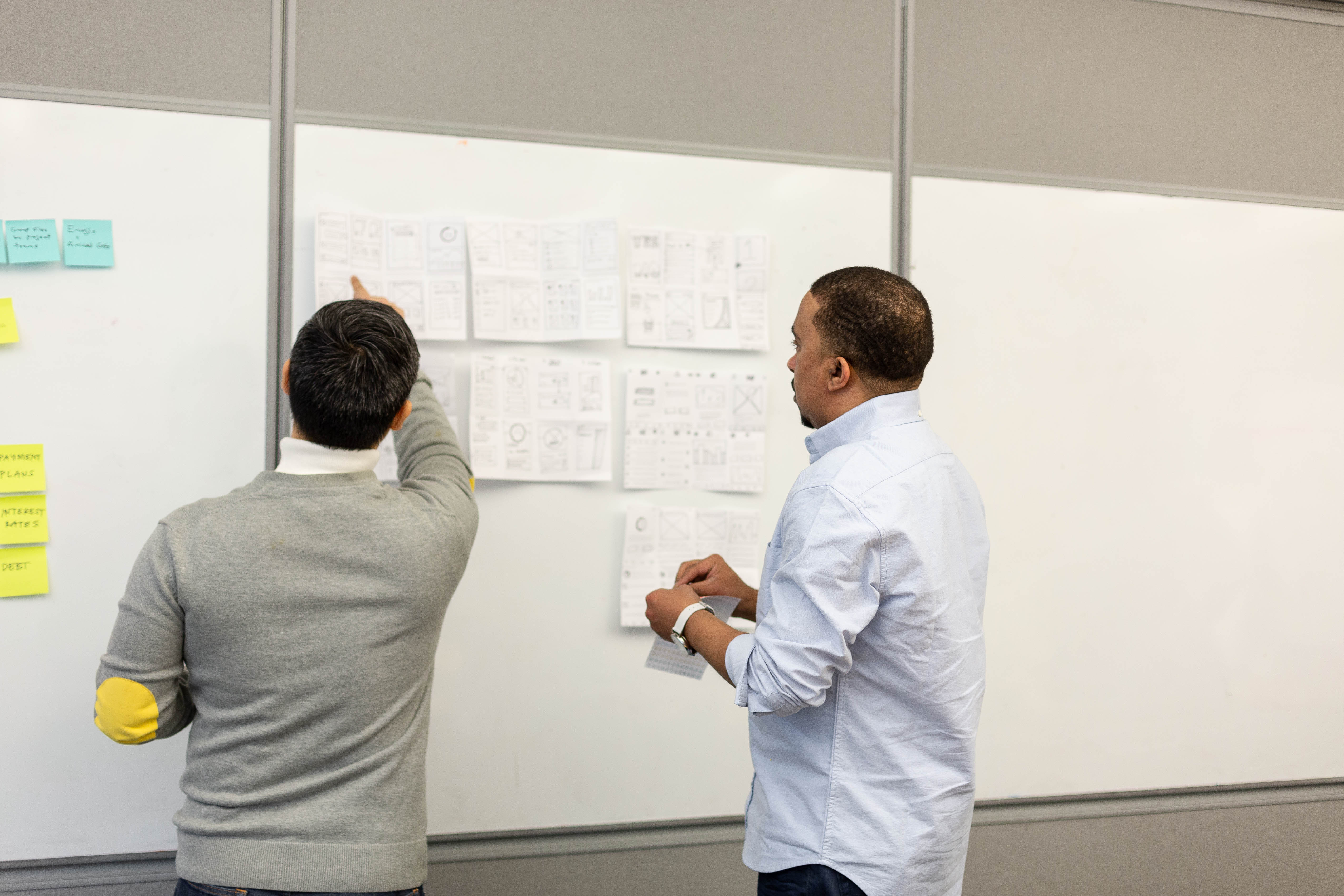 Whiteboard wireframes mapping the old funnel against user research